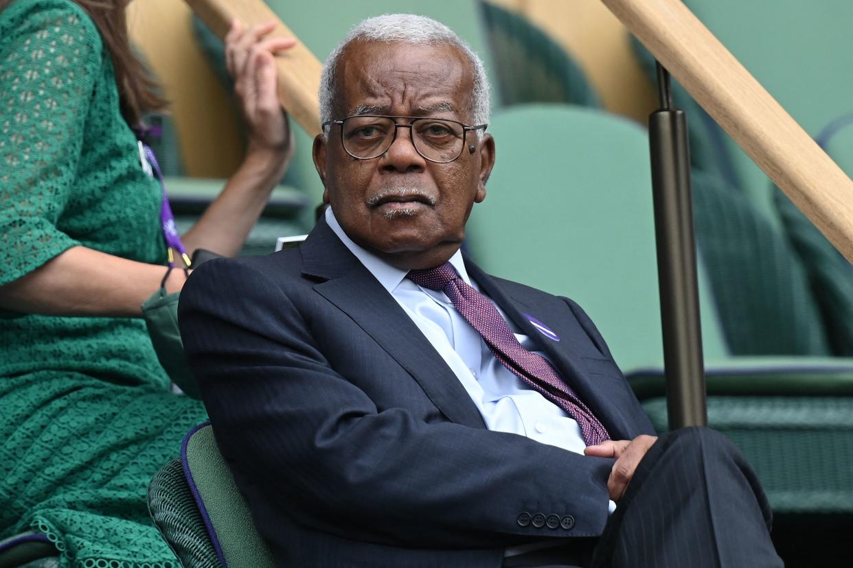 Trinidadian-British journalist Trevor McDonald sits in the Royal Box to watch Serbia's Novak Djokovic play against Hungary's Marton Fucsovics during their men's quarter-finals match on the ninth day of the 2021 Wimbledon Championships at The All England Tennis Club in Wimbledon, southwest London, on July 7, 2021. - - RESTRICTED TO EDITORIAL USE (Photo by Glyn KIRK / AFP) / RESTRICTED TO EDITORIAL USE (Photo by GLYN KIRK/AFP via Getty Images)