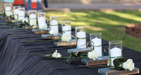 Candles line a table during a vigil held at the Texas First Bank after a shooting left several people dead at Santa Fe High School in Santa Fe, Texas, U.S., May 18, 2018. REUTERS/Trish Badger