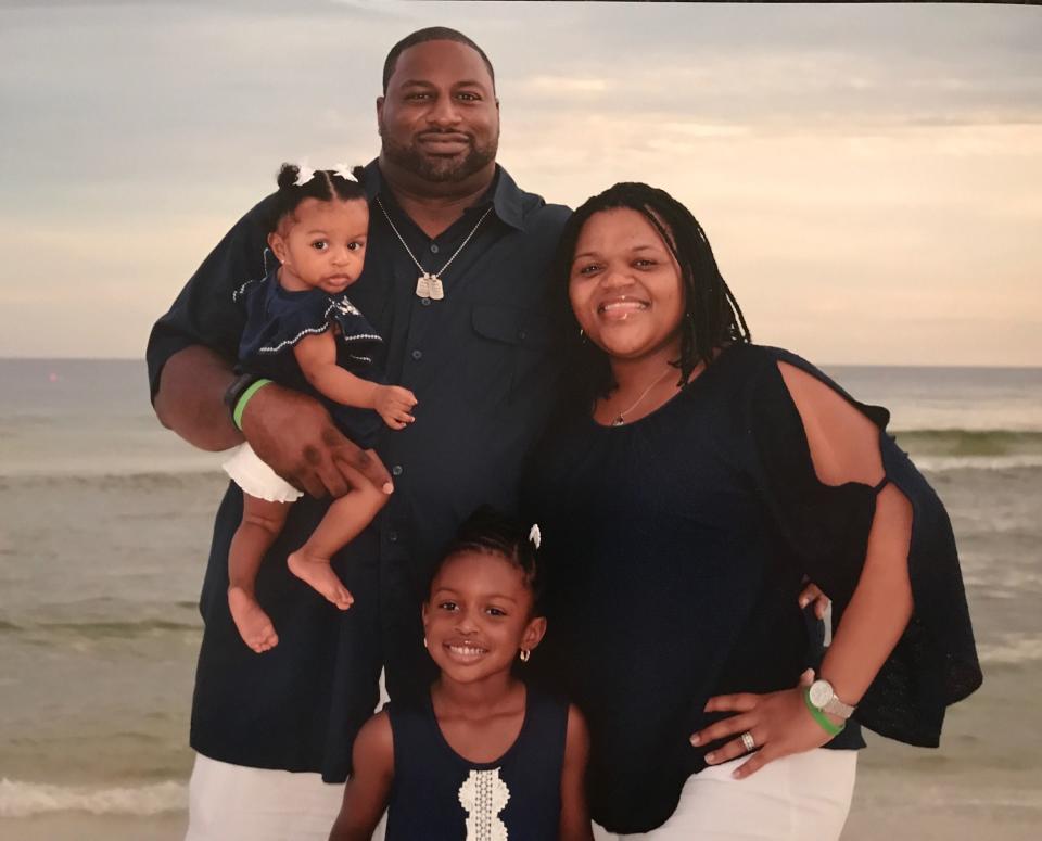 Lushers Lane is shown in this file photo with his wife, Tangela, and their two daughters. Lane was a PE teacher with Montgomery Public Schools for 10 years and worked at the Department of Youth Service for 13 years, according to the scholarship's website. He died from COVID-19 in January 2021.