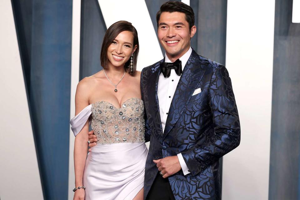 Liv Lo and Henry Golding attend the 2022 Vanity Fair Oscar Party hosted by Radhika Jones at Wallis Annenberg Center for the Performing Arts on March 27, 2022 in Beverly Hills, California.