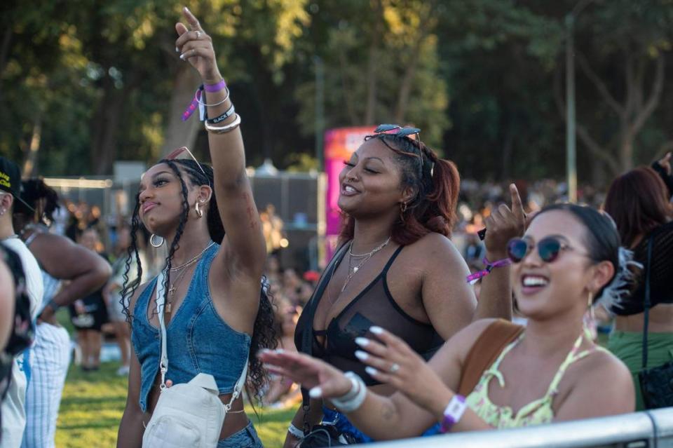 Jordyn Baylis, left, of Sacramento, Kylé-Ann Bobo, center, of Sacramento, and Lynn Ly, of Los Angeles, dance to music while they wait for rapper Joey Badass to perform on the first day of the Sol Blume R&B festival on Saturday.