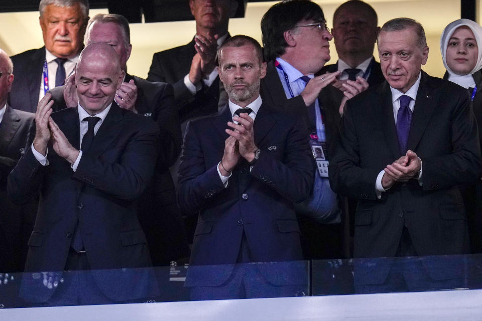 FILE - From left, FIFA President Gianni Infantino, UEFA president Aleksander Ceferin, and Turkish President Recep Tayyip Erdogan, before the Champions League final soccer match between Manchester City and Inter Milan at the Ataturk Olympic Stadium in Istanbul, on June 10, 2023. The Olympics and international soccer once lived through very public corruption crises. The International Olympic Committee had the Salt Lake City bidding scandal. Soccer faced waves of bribery allegations in 2015 that removed the FIFA and UEFA presidents. In crisis they agreed to limit presidents to 12 years in office to help curb power cliques. This rule now faces pushback. (AP Photo/Manu Fernandez, File)