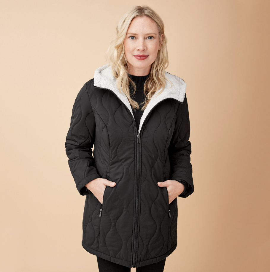 blonde model wearing black Sherpa Lined Quilted Coat (Photo via Northern Reflections)