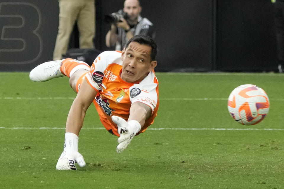 León goalkeeper Rodolfo Cota (30) deflects a shot on goal by Los Angeles FC during the first half in the second leg of a CONCACAF championship final soccer match, Sunday, June 4, 2023, in Los Angeles. (AP Photo/Marcio Jose Sanchez)