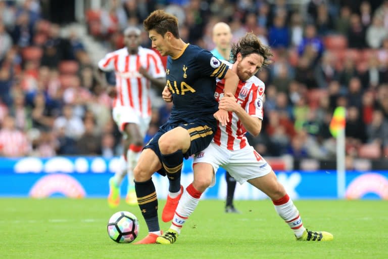 Stoke City's midfielder Joe Allen (R) vies with Tottenham Hotspur's striker Son Heung-Min during an English Premier League football match at the Bet365 Stadium in Stoke-on-Trent, central England