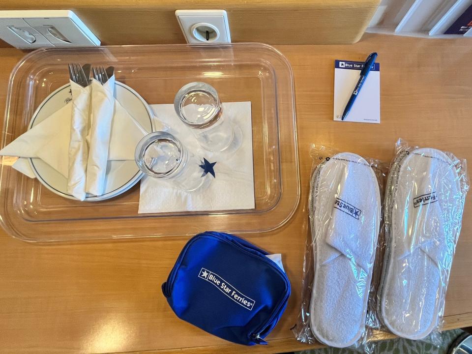 complimentary blue star ferry items in a deluxe ferry cabin