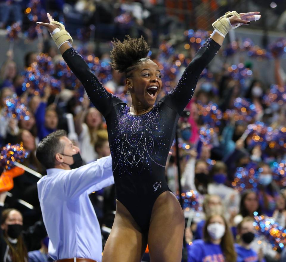 University of Florida gymnast Trinity Thomas celebrates her vault during the opening meet of the year at the Exactech Arena in Gainesville Jan 7, 2022. The Gators won the quad meet over Rutgers, Northern Illinois and Texas Woman's University with a score of 197.675.