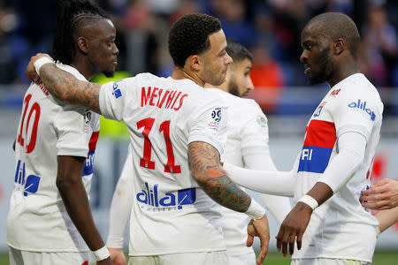 Soccer Football - Ligue 1 - Olympique Lyonnais vs Amiens SC - Groupama Stadium, Lyon, France - April 14, 2018 Lyon's Bertrand Traore celebrates scoring their third goal with teammates REUTERS/Emmanuel Foudrot