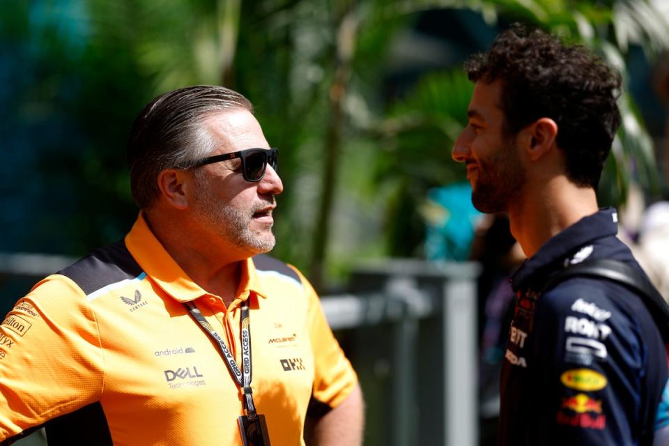 Ricciardo speaks to former boss Zak Brown at the Miami Grand Prix in May (Getty)