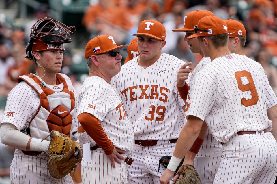 Texas head baseball coach David Pierce talks to his players on the mound after an inning of poor pitching against Indiana at UFCU Disch-Falk Field in February.