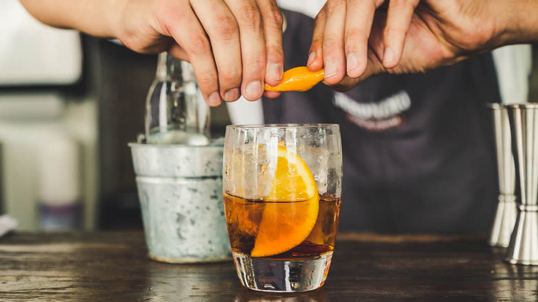 bartender making martini on bar