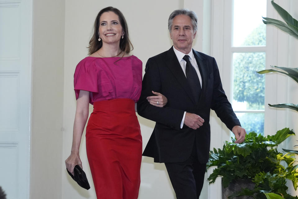 Secretary of State Antony Blinken and Evan Ryan, Assistant to the President and Cabinet Secretary, arrive at the Booksellers area of the White House for the State Dinner hosted by President Joe Biden and first lady Jill Biden for Japan's Prime Minister Fumio Kishida, and wife Kishida Yuko, Wednesday, April 10, 2024, in Washington. (AP Photo/Jacquelyn Martin)