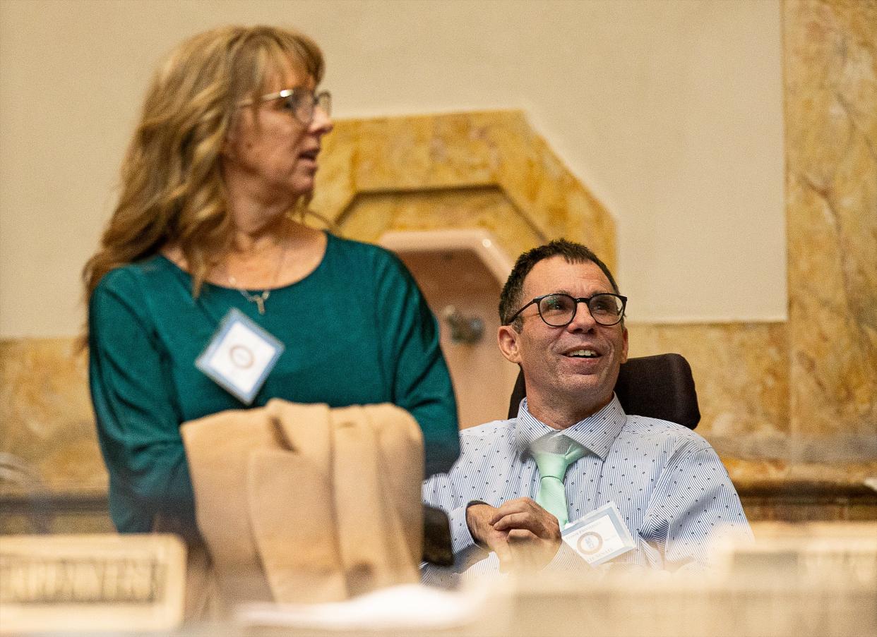 Eric Crawford, right, and his wife Michelle Crawford smiled on the Senate floor before lawmakers voted on SB 47, a bill legalizing medical marijuana. The measure passed on a 26-11 vote and now heads to the Kentucky House. Mar. 16, 2023