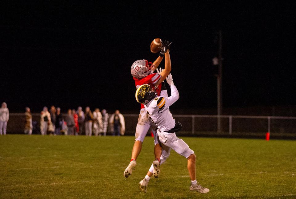 Colonel Crawford's Brady Hill interrupts a pass intended for Buckeye Central's Heath Jensen.