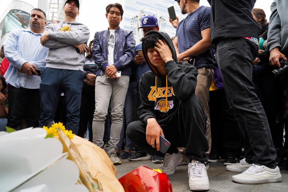 Tributes: The Staples Centre fast became a destination for fans who wanted to share their condolences (Getty Images)