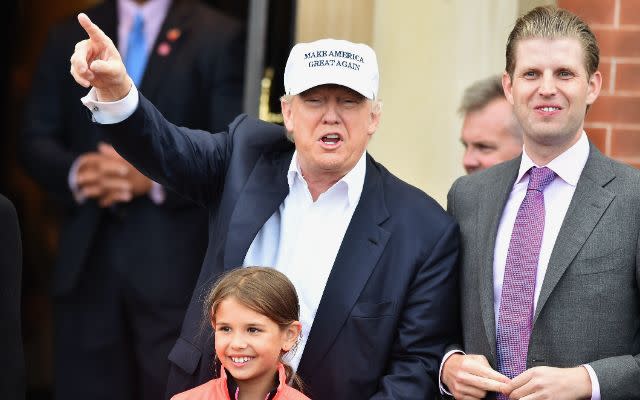 AYR, SCOTLAND – JUNE 24: Presumptive Republican nominee for US president Donald Trump, with son Eric Trump (R) and granddaughter Kai Trump, arrive at his Trump Turnberry Resort on June 24, 2016 in Ayr, Scotland. Trump officially opened his golf resort which has undergone an eight month refurbishment as part of an investment thought to be worth in the region of two hundred million pounds. (Photo by Jeff J Mitchell/Getty Images)<br>