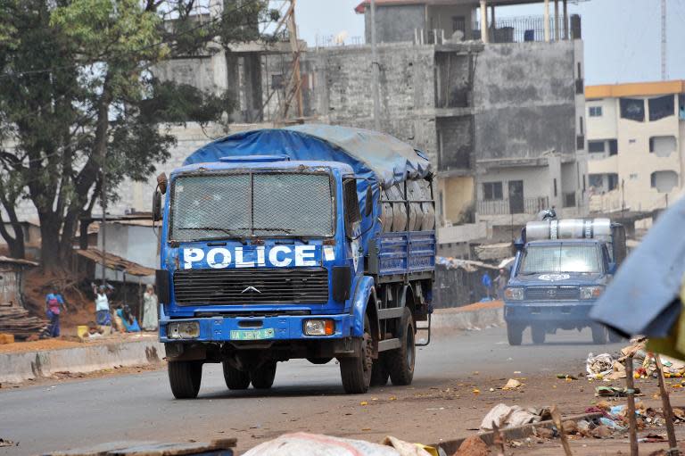 Security forces patrol the streets during clashes with anti-government protesters in Conakry on May 4, 2015