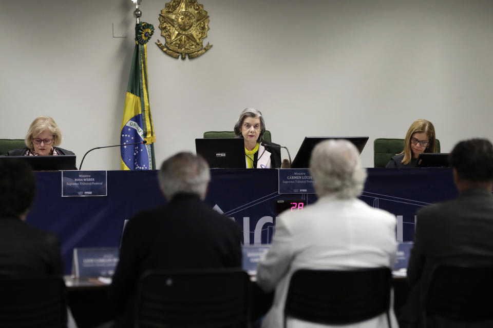 Brazilian Supreme Court Minister Carmen Lucia, center, presides a public hearing on freedom of artistic expression at the Supreme Court headquarters in Brasilia, Brazil, Monday, Nov. 4, 2019. Newspaper columnists and celebrated artists are saying that President Jair Bolosonaro’s cultural conservatism may lead to routine censorship and public money drying up for progressive artistic projects. (AP Photo/Eraldo Peres)