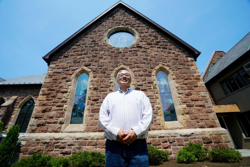 Rev. Richard Hong outside the rebuilt First Presbyterian Church in Englewood on Tuesday, July 17. The church, which was severely damaged by fire in April 2016, is expected to reopen its sanctuary for Sunday services next month. A formal dedication is set for Sept. 29.