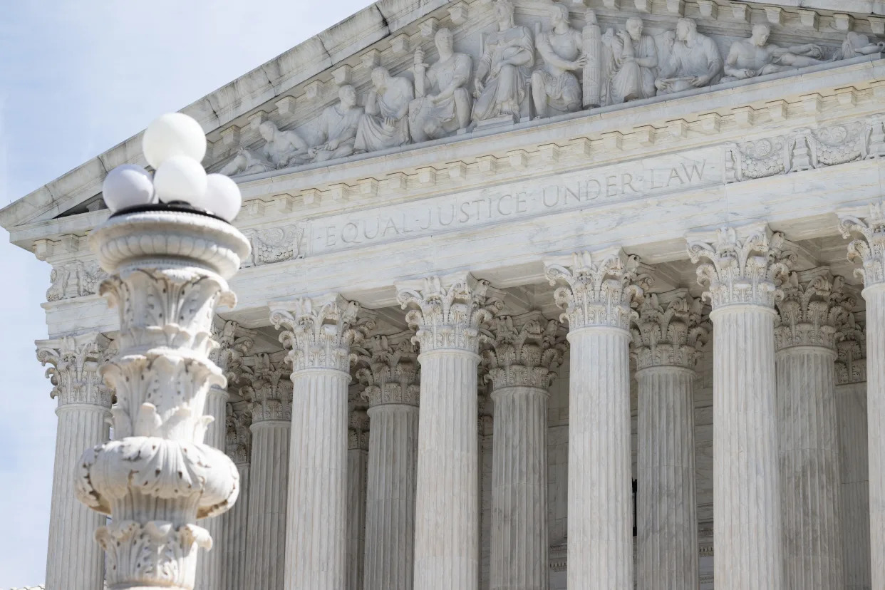 The front of the Supreme Court has a carved panel above the columns that reads: Equal justice under law.