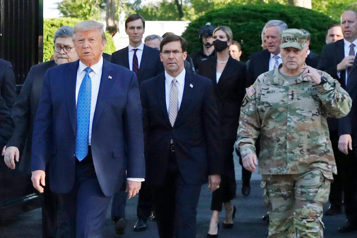 President Donald Trump departs the White House to visit outside St. John's Church, in Washington on June 1, 2020. Part of the church was set on fire during protests on Sunday night. Walking behind Trump from left are, Attorney General William Barr, Secretary of Defense Mark Esper and Gen. Mark Milley, chairman of the Joint Chiefs of Staff.  Milley says his presence “created a perception of the military involved in domestic politics.” He called it “a mistake” that he has learned from.