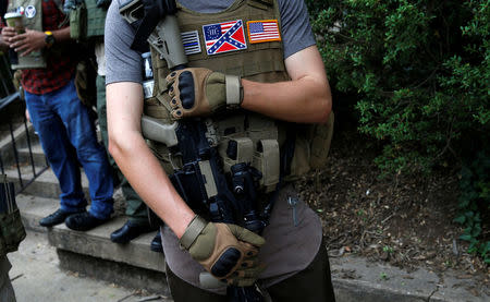 A member of a militia stands near a rally in Charlottesville. REUTERS/Joshua Roberts