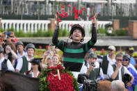 Brian Hernandez Jr. celebrates in the winner's circle after riding Mystik Dan to win the 150th running of the Kentucky Derby horse race at Churchill Downs Saturday, May 4, 2024, in Louisville, Ky. (AP Photo/Jeff Roberson)