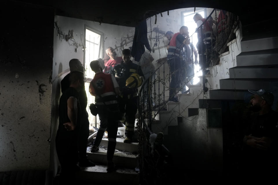 Palestinian first responders work inside a home destroyed in an Israeli military operation in the West Bank city of Jenin, Friday, July 5, 2024. The Israeli military said Friday it was conducting counterterrorism activity that included an airstrike in the area of the West Bank city of Jenin. Palestinian authorities said five people were killed. (AP Photo/Majdi Mohammed)