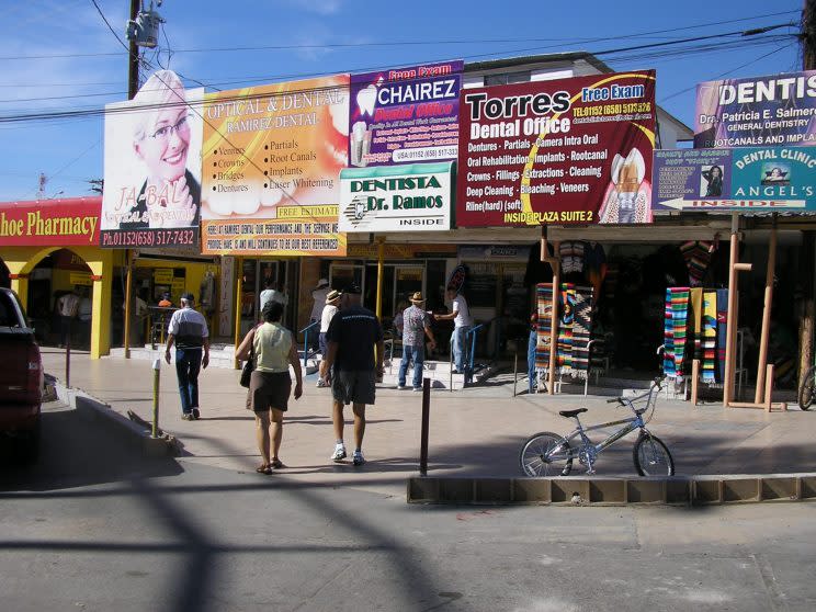 Less than a block after crossing into Mexico, U.S. tourists are bombarded with billboards touting the dental services in Los Algodones. (Photo: Oscar Avila/Chicago Tribune/MCT via Getty Images)