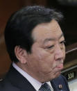 Japanese Prime Minister Yoshihiko Noda stands still upon dissolving the lower house of parliament in Tokyo Friday, Nov. 16, 2012. Noda dissolved the lower house of parliament Friday, paving the way for elections in which his ruling party will likely give way to a weak coalition government divided over how to solve Japan's myriad problems. (AP Photo/Koji Sasahara)