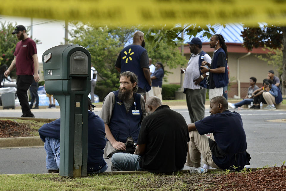 Employees gather in a nearby parking lot after a shooting at a Walmart store Tuesday, July 30, 2019 in Southaven, Miss. (Photo: Brandon Dill/AP)