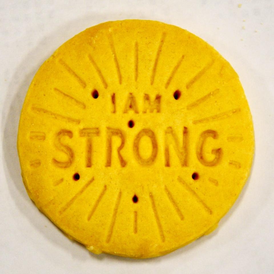 The new Girl Scout Cookie is Lemon-Ups, a crispy lemon cookie baked with messages inspired by Girl Scout entrepreneurs.