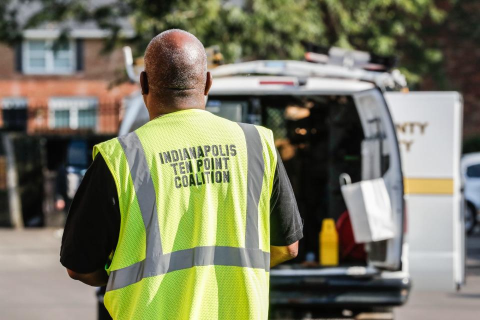 Rev. Ernest Turner with the Ten Point Coalition arrives on the scene of a double homicide at 4100 Windhill Dr. in the Postbrook East appartments on Thursday, Aug. 23, 2019. The apartments are within the Ten Point Coalitions patrol area.