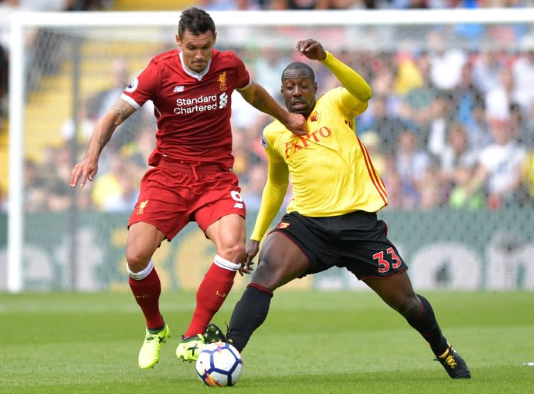 Liverpool's defender Dejan Lovren (L) vies with Watford's striker Stefano Okaka during the English Premier League football match August 12, 2017