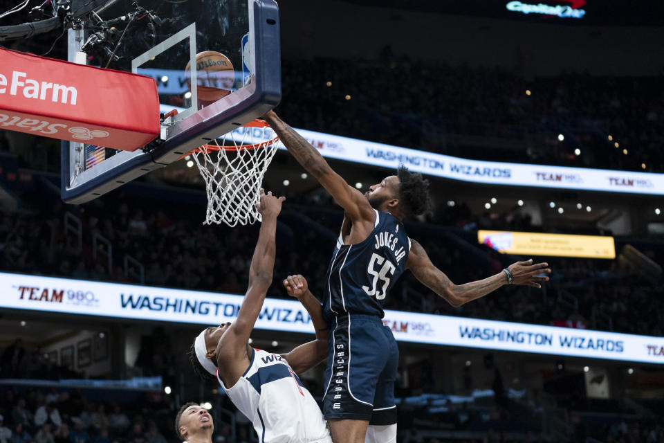 Washington Wizards guard Bilal Coulibaly (0) shoots against Dallas Mavericks forward Derrick Jones Jr. (55) during the first half of an NBA basketball game Wednesday, Nov. 15, 2023, in Washington. (AP Photo/Stephanie Scarbrough)