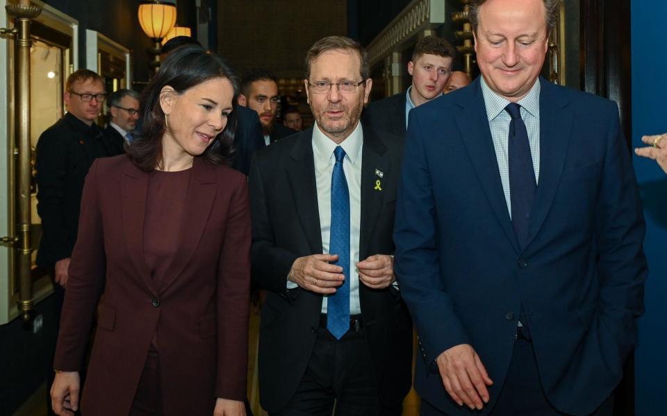 Isaac Herzog, the Israeli president, with Lord Cameron and Annalena Baerbock, the German foreign minister, in Jerusalem