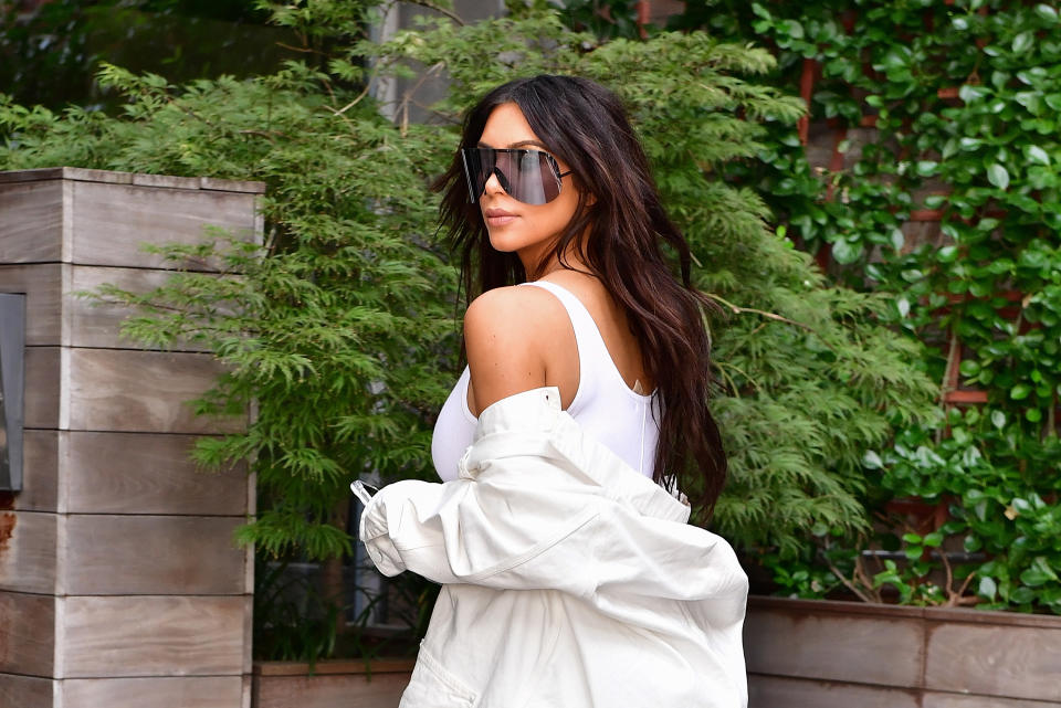 Kim Kardashian SLAYS IT in a casual black corset, leaving us to wonder, where can we get a casual corset?