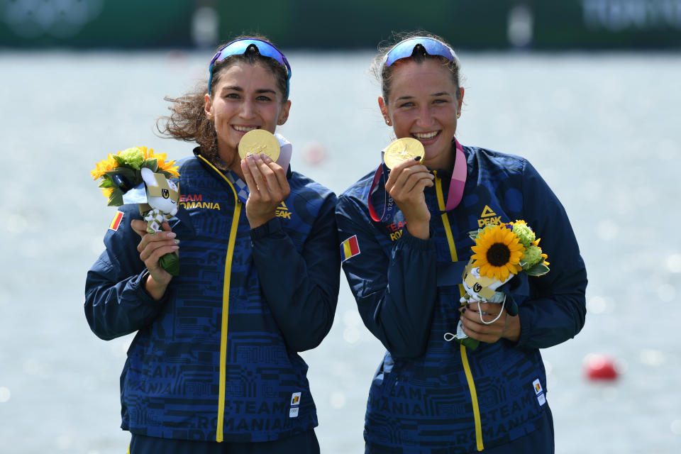 Ancuta Bodnar and Simona-Geanina Radis pose with their gold medals
