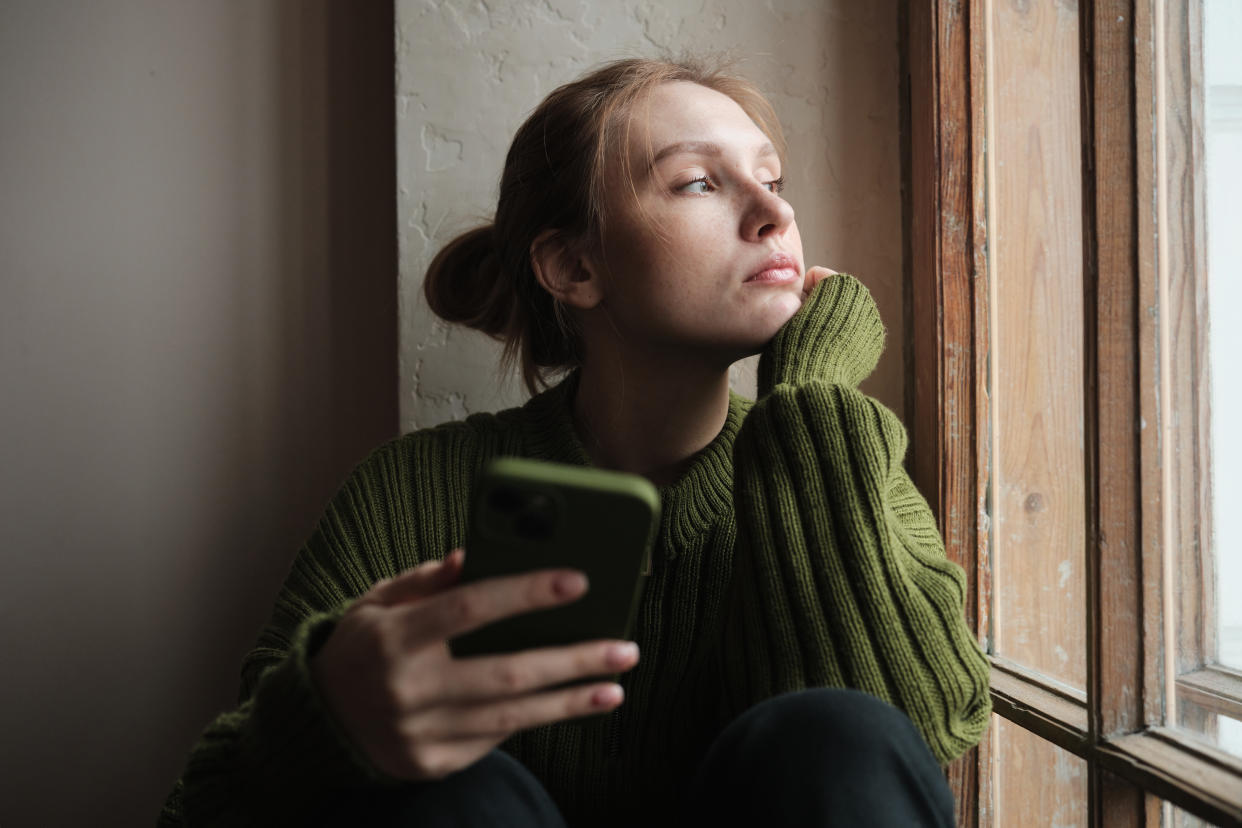 Woman alone with smartphone