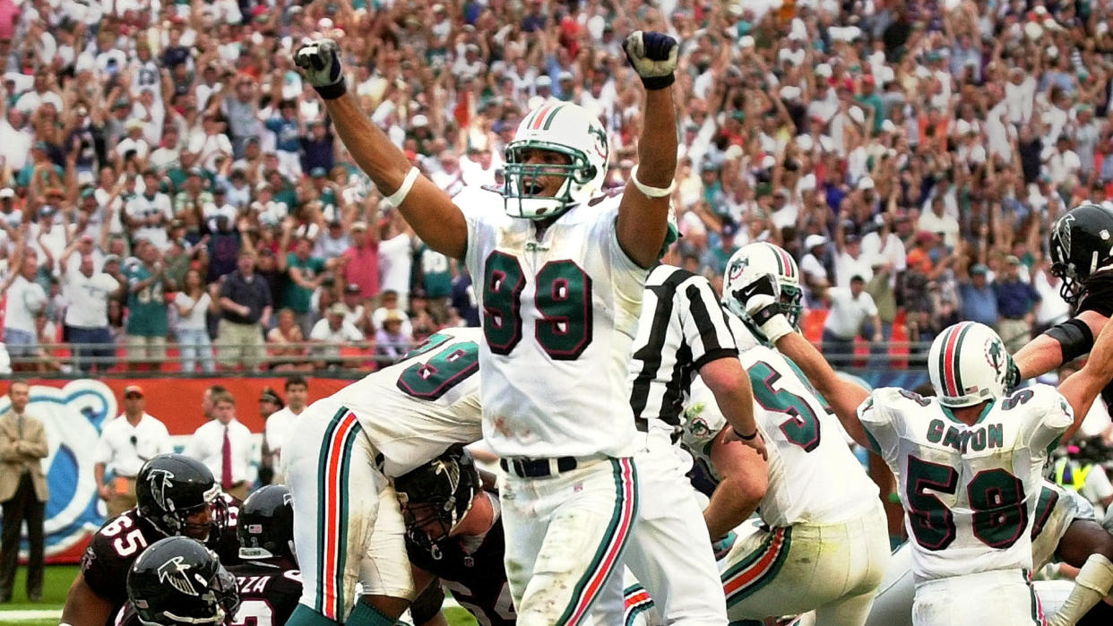 Mandatory Credit: Photo by Tony Gutierrez/AP/Shutterstock (6456382a)TAYLOR Miami Dolphins' Jason Taylor (99) celebrates his teams goal line stand against the Atlanta Falcons that sealed the 21-14 Dolphins win, at Pro Player Stadium in MIamiFALCONS DOLPHINS, MIAMI, USA.