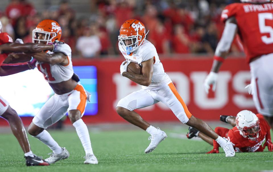 Sep 23, 2023; Houston, Texas, USA; Sam Houston State Bearkats wide receiver Malik Phillips (19) runs with the ball during the fourth quarter against the Houston Cougars at TDECU Stadium. Mandatory Credit: Troy Taormina-USA TODAY Sports
