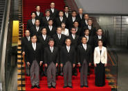 Japan's Prime Minister Yoshihide Suga, front center, and his cabinet ministers pose for a photo session at Suga's official residence in Tokyo, Japan, Wednesday, Sept. 16, 2020. Japan's Parliament elected Suga as prime minister Wednesday, replacing long-serving leader Shinzo Abe with his right-hand man. (Issei Kato/Pool Photo via AP)