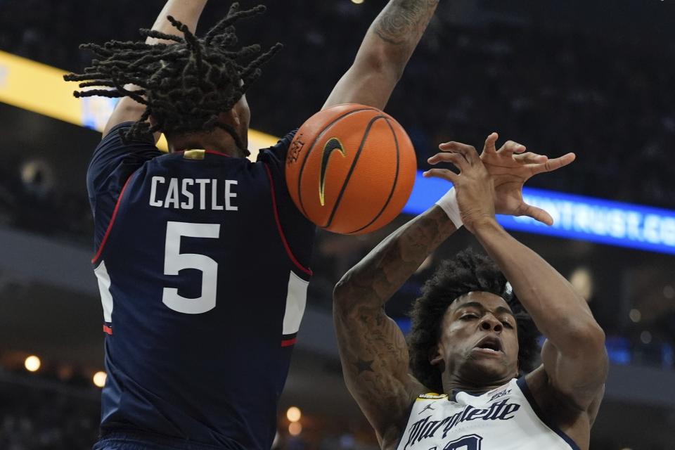 Marquette's Zaide Lowery is fouled by UConn's Stephon Castle during the first half of an NCAA college basketball game Wednesday, March 6, 2024, in Milwaukee. (AP Photo/Morry Gash)