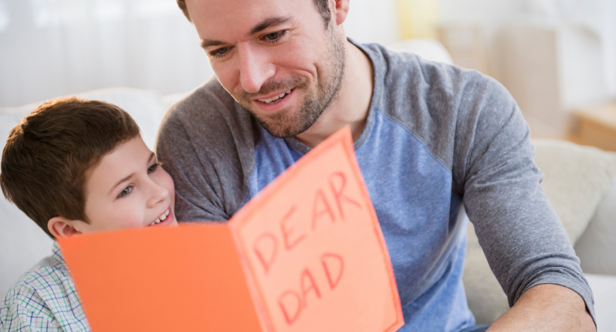 man reading orange dear dad card with child, father's day 2022 gift ideas