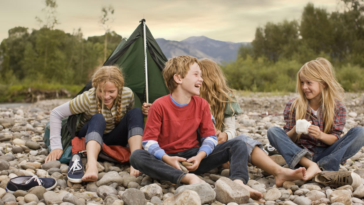  Camping with kids: kids having fun camping. 