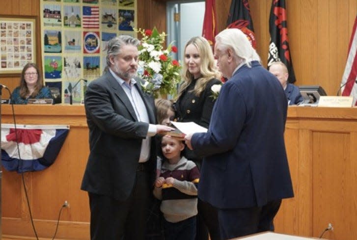 Jon Kurpis is sworn in as a Saddle River councilman by his father, Mayor Albert Kurpis.
