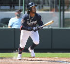 Atlanta Braves' Ozzie Albies hits a solo homerun against the Baltimore Orioles during the fourth inning of a spring baseball game at CoolToday Park in North Port, Fla., Wednesday, March 3, 2021. (Curtis Compton/Atlanta Journal-Constitution via AP)