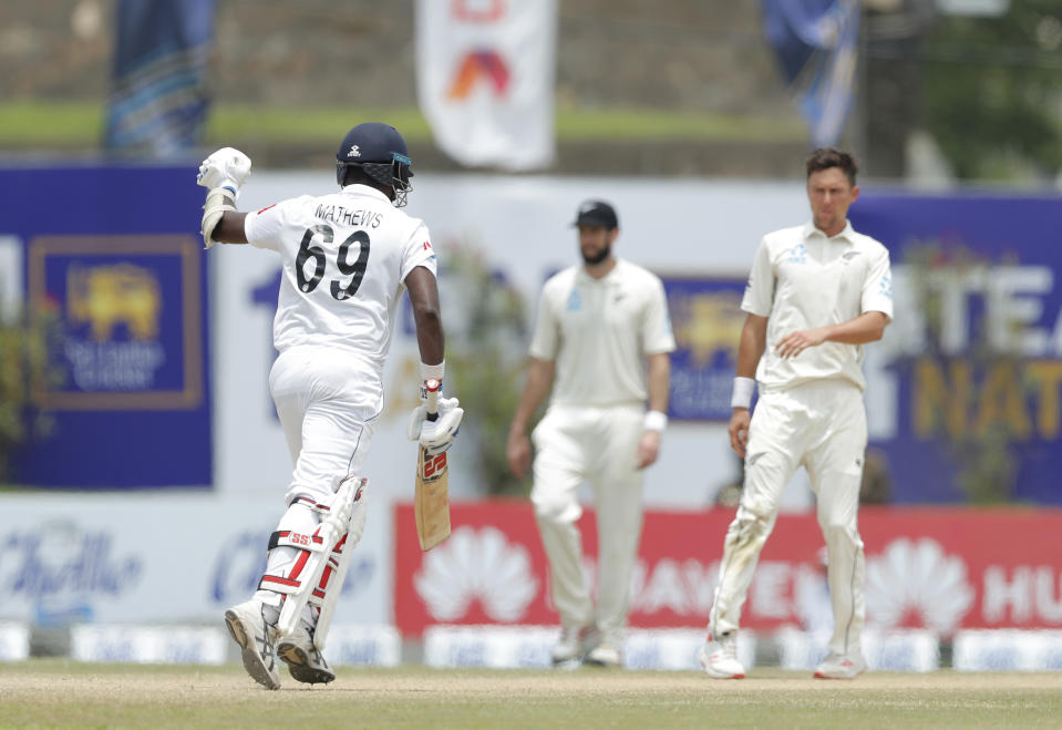 Sri Lanka's Angelo Mathews punches in the air as he completes the winning run over New Zealand in the first test cricket match in Galle, Sri Lanka, Sunday, Aug. 18, 2019. (AP Photo/Eranga Jayawardena)