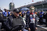 A.J. Foyt talks with Santino Ferrucci during qualifications for the Indianapolis 500 auto race at Indianapolis Motor Speedway, Saturday, May 20, 2023, in Indianapolis. (AP Photo/Darron Cummings)