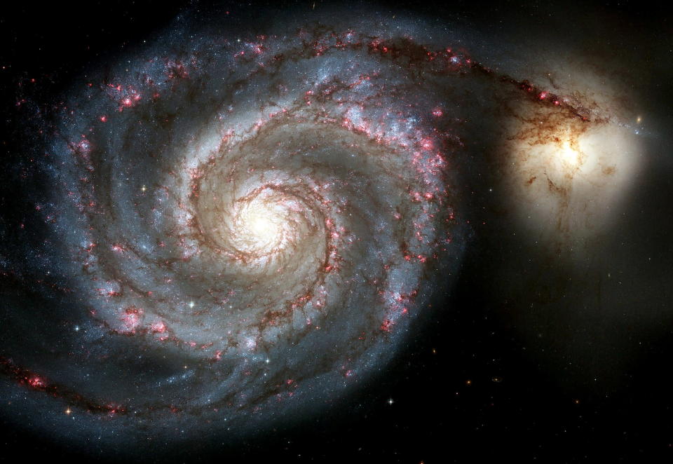 A new view of the Whirlpool Galaxy, one of the two largest and sharpest images Hubble Space Telescope has ever taken, is released by NASA on Hubble's 15th anniversary April 25, 2005. The new Whirlpool Galaxy image showcases the spiral galaxy's curving arms where newborn stars reside and its yellowish central core that serves as home for older stars. During the 15 years Hubble has orbited the Earth, it has taken more than 700,000 photos of the cosmos. (CREDIT : REUTERS/NASA/Handout)